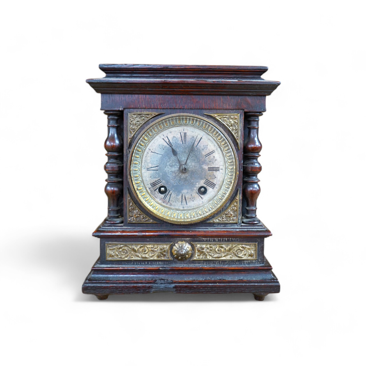 A late Victorian oak eight day mantel clock, striking on a coiled gong, height 26.5cm. Condition - fair, wear and oxidisation to dial.